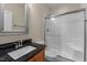 Bathroom featuring a granite countertop and a shower with glass doors at 1021 Traditions Meadow Dr, Wake Forest, NC 27587