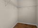Empty closet with wooden flooring and wire shelving ready for storage at 1021 Traditions Meadow Dr, Wake Forest, NC 27587