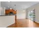 Kitchen area showcasing breakfast bar seating, stainless appliances, and sliding glass doors at 1021 Traditions Meadow Dr, Wake Forest, NC 27587