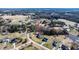Aerial view of a beautiful home in a neighborhood near farmland and a wooded area at 105 Glasgow Dr, Clayton, NC 27520