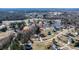 Aerial shot of a house with a lake and a wooded area in a charming neighborhood at 105 Glasgow Dr, Clayton, NC 27520