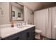 Updated bathroom featuring stylish vanity with modern sink and silver framed mirror at 105 Glasgow Dr, Clayton, NC 27520