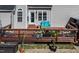 View of the wooden deck with outdoor seating area, including chairs and a small bench at 105 Glasgow Dr, Clayton, NC 27520
