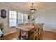 Charming dining room with natural light and rustic wooden table at 105 Glasgow Dr, Clayton, NC 27520