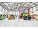 Large garage featuring high ceilings, a car lift and room for multiple cars and equipment at 105 Glasgow Dr, Clayton, NC 27520
