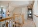 Upstairs hallway with a modern chandelier at 105 Glasgow Dr, Clayton, NC 27520