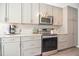 Updated kitchen with stainless steel appliances and modern cabinets at 105 Glasgow Dr, Clayton, NC 27520