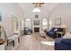 Vaulted living room with a fireplace, neutral walls, and bright wood flooring at 105 Glasgow Dr, Clayton, NC 27520