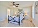 Comfortable main bedroom with a ceiling fan, carpeted floor, and boat-themed artwork at 105 Glasgow Dr, Clayton, NC 27520