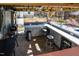 Outdoor covered kitchen with a grill, mini fridge, lots of prep area, and bar seating at 105 Glasgow Dr, Clayton, NC 27520