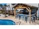 Outdoor bar featuring seating for six, grill, and outdoor decor at 105 Glasgow Dr, Clayton, NC 27520