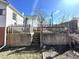 Backyard with a fence, green roof, and raised concrete patio at 108 Holt St, Hillsborough, NC 27278