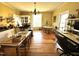 Charming kitchen with hardwood floors, vintage stove, and eclectic decor at 108 Holt St, Hillsborough, NC 27278
