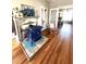 Living room showing an antique wood stove and hardwood floors at 108 Holt St, Hillsborough, NC 27278