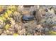 Aerial view of a home featuring a screened-in porch, wooden deck with pergola, and wooded back yard at 1117 Pine Trl, Clayton, NC 27520