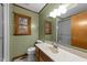 Bathroom with single vanity, mirror, toilet, and walk-in shower at 1117 Pine Trl, Clayton, NC 27520