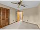 Bedroom with neutral carpet and access to hall and closet with louvered doors at 1117 Pine Trl, Clayton, NC 27520