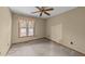 Bedroom with neutral carpet, window with blinds, and ceiling fan at 1117 Pine Trl, Clayton, NC 27520
