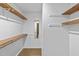 Walk-in closet with multiple shelves at 1117 Pine Trl, Clayton, NC 27520
