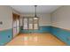 Dining room featuring hardwood floors, window with blinds, and closet at 1117 Pine Trl, Clayton, NC 27520