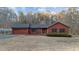 Charming single-Gathering home with a well-maintained lawn, an attached garage, and wood paneled siding at 1117 Pine Trl, Clayton, NC 27520