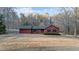 Charming single-Gathering home with a well-maintained lawn, an attached garage, and wood paneled siding at 1117 Pine Trl, Clayton, NC 27520