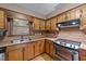 Kitchen featuring wood cabinets and stainless steel oven at 1117 Pine Trl, Clayton, NC 27520