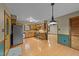 Eat-in kitchen area with updated appliances, hardwood floors, wood cabinetry and eat-in dining at 1117 Pine Trl, Clayton, NC 27520