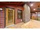 Screened-in porch with brick and natural lighting, leading to an outdoor space at 1117 Pine Trl, Clayton, NC 27520