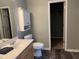 Bathroom featuring a vanity and a toilet with a view into the closet at 1208 Shining Water Ln, Creedmoor, NC 27522