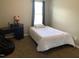 Bedroom featuring a bed, desk, and window with curtains at 1208 Shining Water Ln, Creedmoor, NC 27522