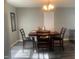 Cozy dining room featuring modern light fixture and wood flooring at 1208 Shining Water Ln, Creedmoor, NC 27522