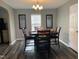 Cozy dining room featuring modern light fixture and wood flooring at 1208 Shining Water Ln, Creedmoor, NC 27522