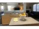 Bright kitchen featuring stainless steel sink, modern faucet, and beautiful countertops at 1208 Shining Water Ln, Creedmoor, NC 27522