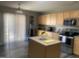 Well-lit kitchen with light wood cabinets, stainless steel appliances, and island at 1208 Shining Water Ln, Creedmoor, NC 27522