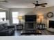 Comfortable living room featuring fireplace, ceiling fan, and neutral paint at 1208 Shining Water Ln, Creedmoor, NC 27522