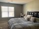 Inviting bedroom with a large window and a comfortable bed with decorative pillows at 1208 Shining Water Ln, Creedmoor, NC 27522