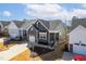 A residential home with a gray exterior, a one-car garage, and landscaped front yard in a suburban community at 1215 White Flint Cir, Durham, NC 27703