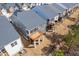 Rear aerial view of multiple new homes with spacious wood decks and manicured lawns at 1215 White Flint Cir, Durham, NC 27703