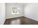 Empty bedroom with hardwood flooring and neighborhood view at 1215 White Flint Cir, Durham, NC 27703