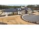 Exterior shot of a modern community clubhouse featuring brick and siding accents and well-manicured grounds at 1215 White Flint Cir, Durham, NC 27703