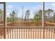 Beautiful view from a wood deck overlooking a lush, wooded backyard landscape at 1215 White Flint Cir, Durham, NC 27703