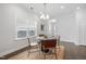 Cozy dining area featuring a modern chandelier and lots of natural light at 1215 White Flint Cir, Durham, NC 27703
