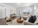 Comfortable living room with hardwood floors, neutral colors, and deck access at 1215 White Flint Cir, Durham, NC 27703