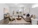 Inviting living room featuring hardwood floors, comfortable seating, and deck access at 1215 White Flint Cir, Durham, NC 27703