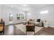 Relaxing living room with hardwood floors, comfortable seating, and deck access at 1215 White Flint Cir, Durham, NC 27703
