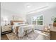 Light and airy main bedroom with tray ceiling and large window at 1215 White Flint Cir, Durham, NC 27703