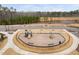 A fenced community playground with play structures and safety surfacing provides recreational space for children at 1215 White Flint Cir, Durham, NC 27703