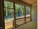 Exterior view from screened porch showcasing wood floors and natural forest view at 122 Sanderway Dr, Chapel Hill, NC 27516