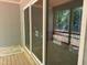 View of the back porch featuring wood floors and modern glass sliding doors at 122 Sanderway Dr, Chapel Hill, NC 27516